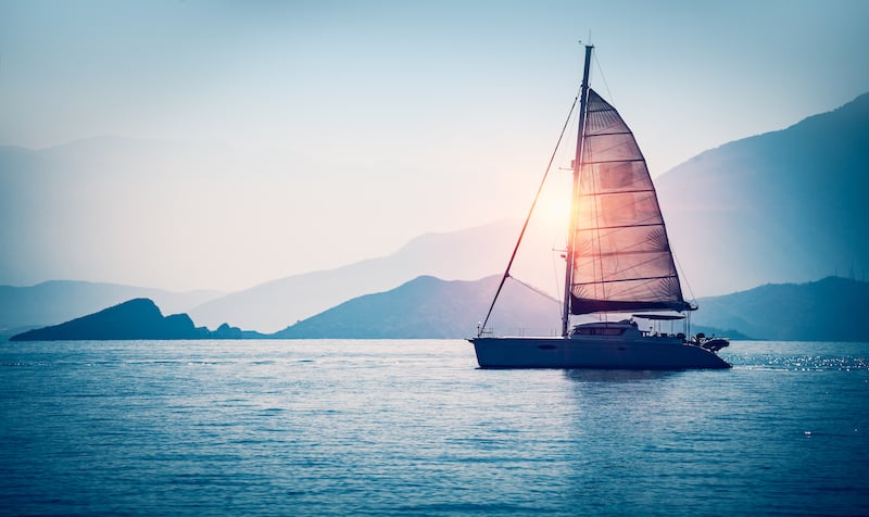 bigstock-Sailboat-in-the-sea-in-the-eve-206103793